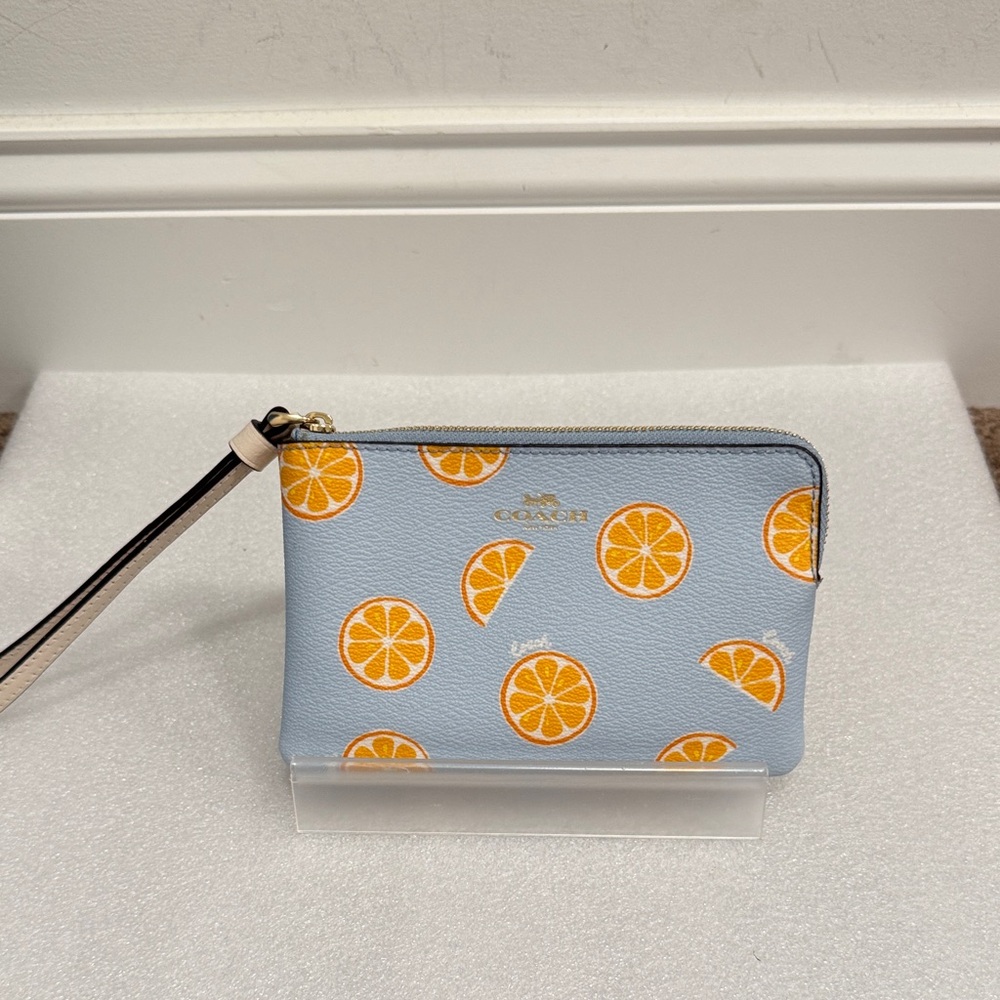 Coach orange citrus print wristlet wallet